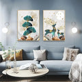 Modern living room with blue sofa, decorative pillows, and nature-themed wall art featuring ginkgo leaves and deer.
