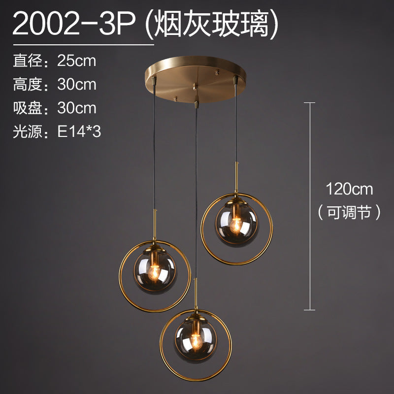 Modern pendant light with three smoked glass globes, brass rings, adjustable 120cm height, E14 bulbs