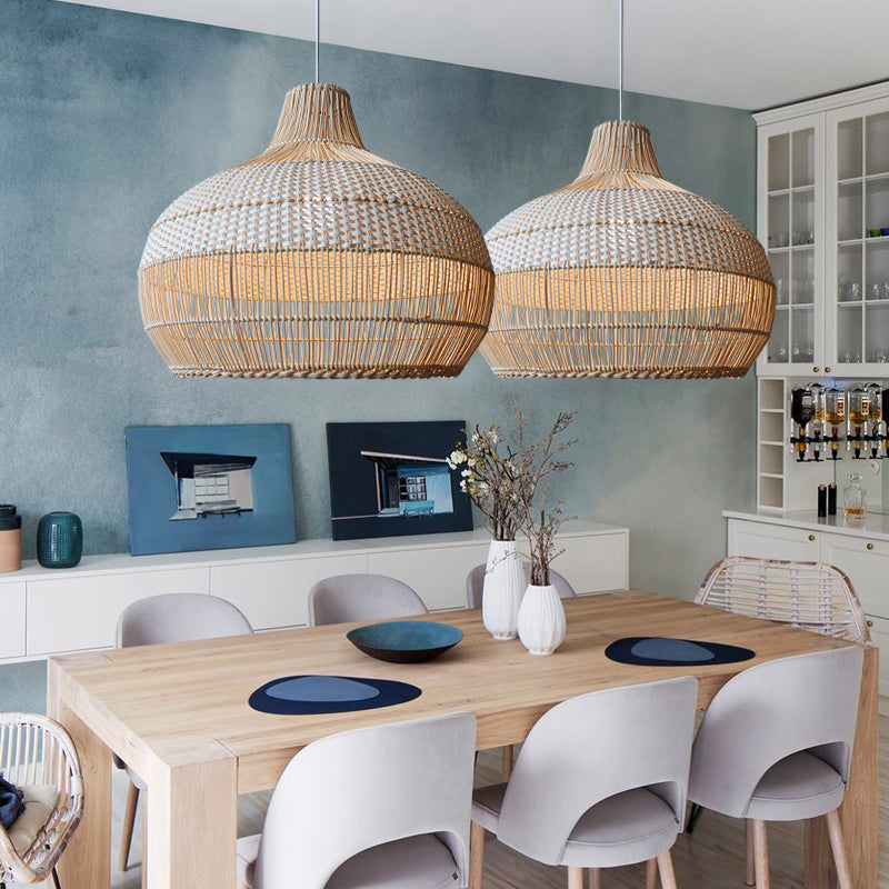 Modern woven pendant lights over wooden dining table with gray chairs, contemporary home decor